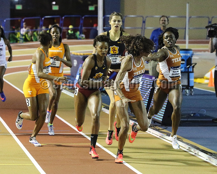 2016NCAAIndoorsSat-0141.JPG - Monolee Akinosum (right) of Texas hands off to anchor runner Courtney Okolo in the womens 4x400. Texas won in 3:28.27 during the NCAA Indoor Track & Field Championships Saturday, March 12, 2016, in Birmingham, Ala. (Spencer Allen/IOS via AP Images)